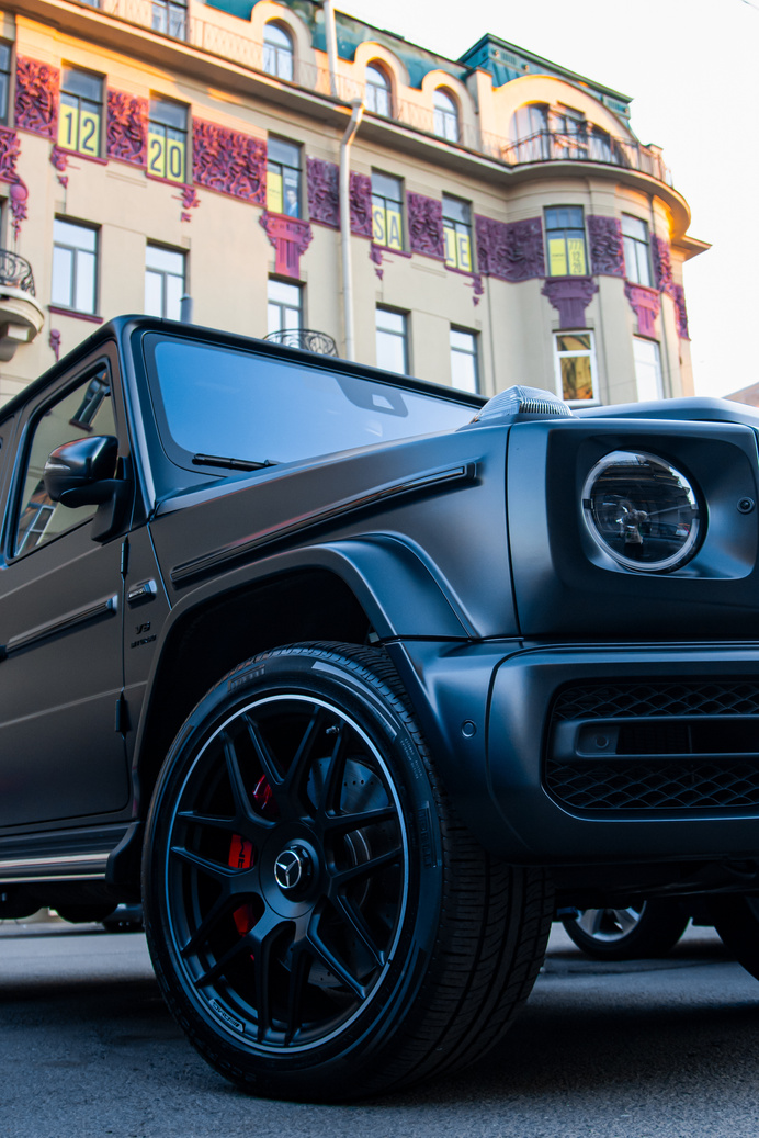 Black Mercedes Benz SUV Parked Near Building